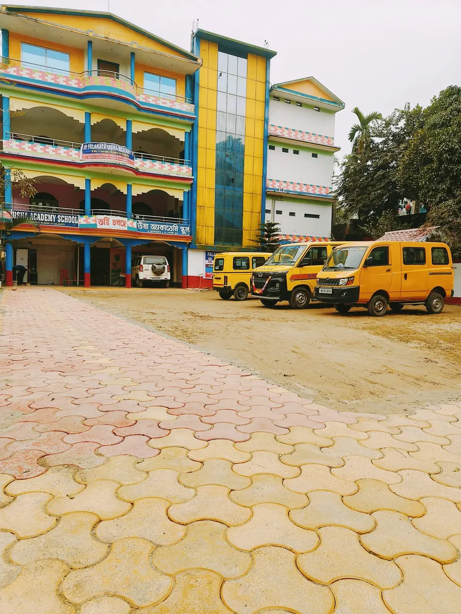 School transport vehicles at Falakata Usha Academy